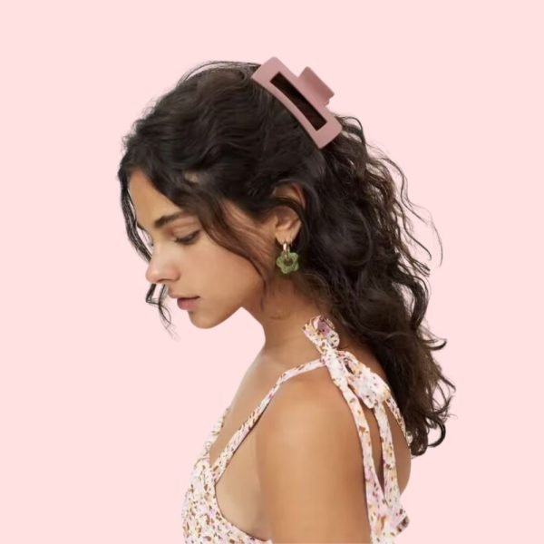 Low bun with a decorative hairclips Form a low bun at the nape of your neck, securing it with a decorative hairclip