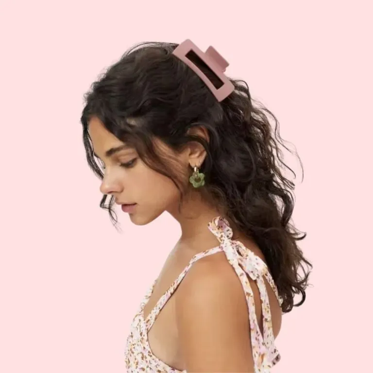 Form a low bun at the nape of your neck, securing it with a decorative hairclip