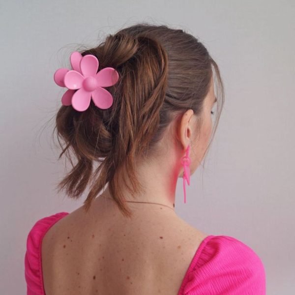 Twist hair into a classic French twist, securing with a metal hair claw. Flower Hairclips
