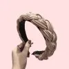 Place a headband at the crown of your head, pushing hair back. Adjust for comfort.