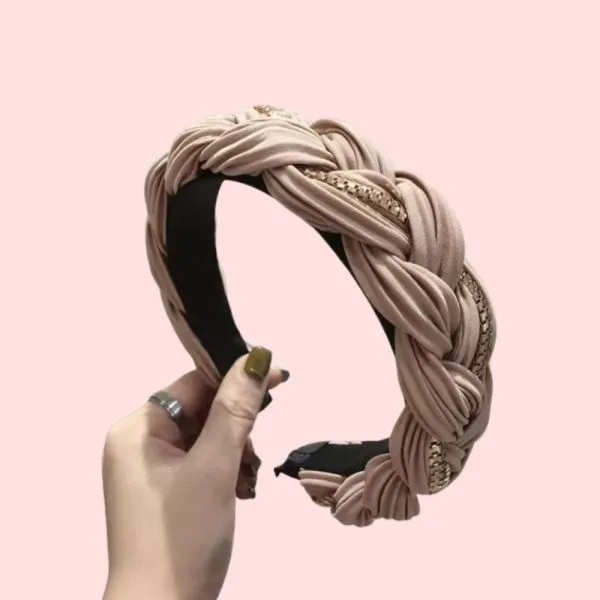 Place a headband at the crown of your head, pushing hair back. Adjust for comfort.