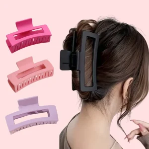 Half-up top knot with a large acrylic hair claw